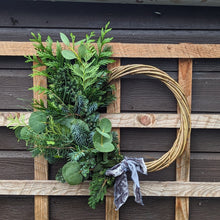Load image into Gallery viewer, partial Christmas wreath with greenery on a willow base