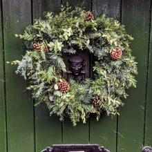 Load image into Gallery viewer, Christmas wreath with greenery and pines cones on a green door