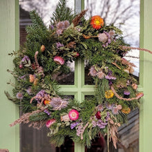 Load image into Gallery viewer, Decorative wreath with flowers and greenery on a door